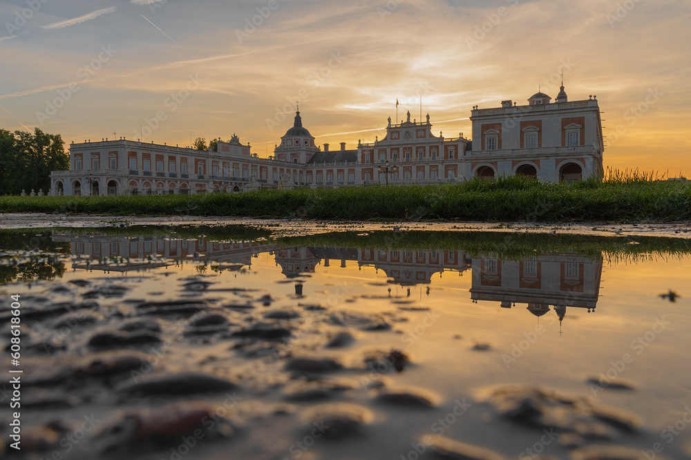 different views with reflections in the water of the royal palace of aranjuez at dawn