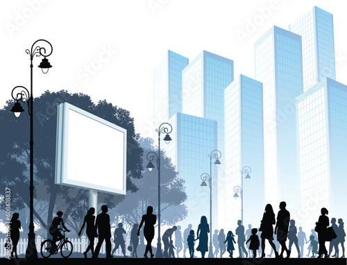 Crowd of people walking on a street.