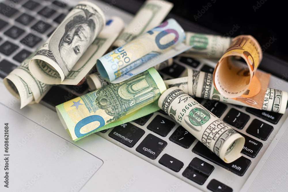 Fototapeta premium Money on computer keyboard. roll