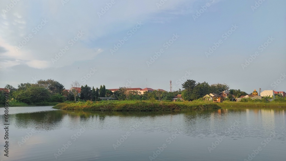 Small lake view in the park of urban area. People going here to hang out or enjoying the environment of this park 