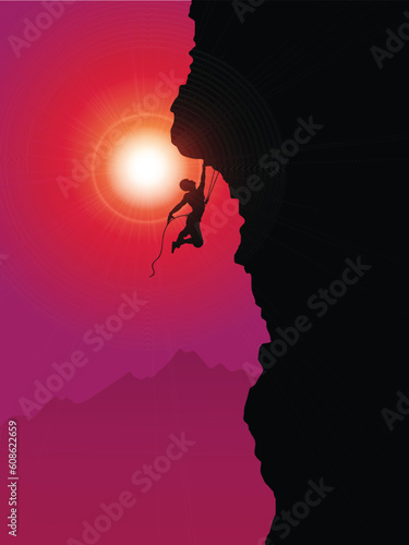 Silhouette of an extreme rock climber climbing a mountain