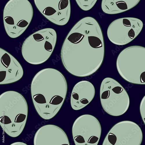 Seamless pattern made up of cartoon alien faces.