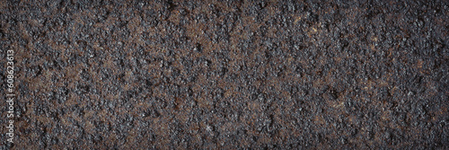 Texture of rusty metal. Rough metal surface with rust. Corroded and oxidized old iron. Rusted and aged metal sheet. Wide panoramic texture for background and design in grunge style.