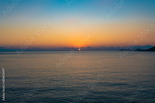 Brightly colored sunset over the calm Mediterranean Sea