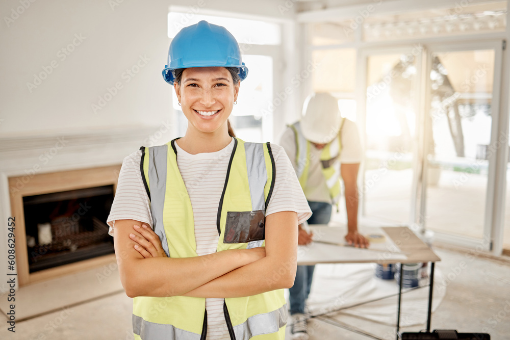 Portrait of woman, construction and home renovation with arms crossed, helmet and smile in apartment. Yes, positive mindset and renovations, happy female in safety and building project in new house. Portrait of woman, construction and home renovation with arms crossed, helmet and smile in apartment. Yes, positive mindset and renovations, happy female in safety and building project in new house.