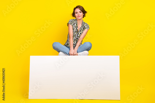 Photo of pretty lovely girlfriend lady dressed fashionable outfit sitting empty space isolated on yellow color background