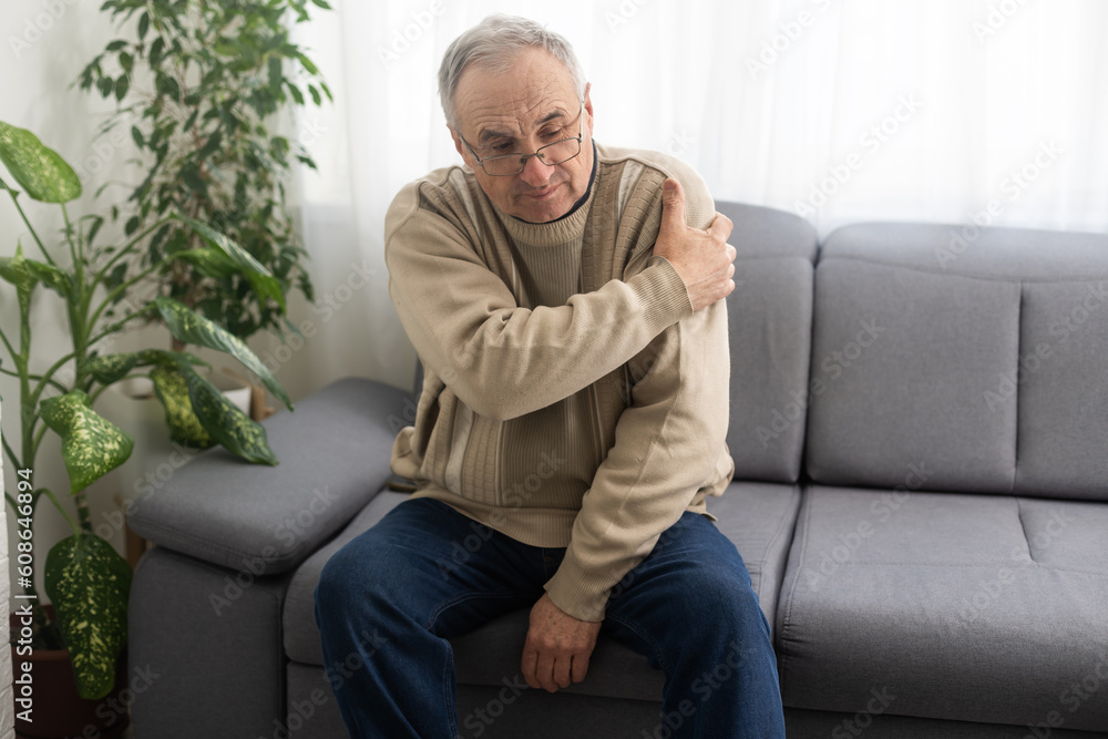 The elderly man suffering from the pain in this man's shoulder was extremely painful and held his shoulder The elderly man suffering from the pain in this man's shoulder was extremely painful and held his shoulder