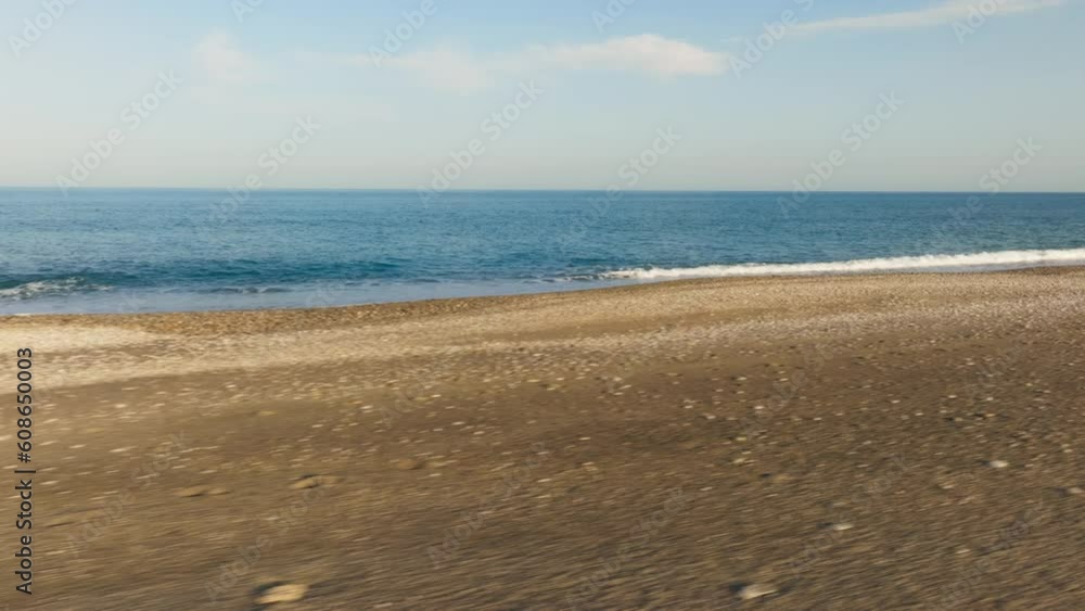 Tidal energy as a renewable source concept with beach and calm ocean Tidal energy as a renewable source concept with beach and calm ocean