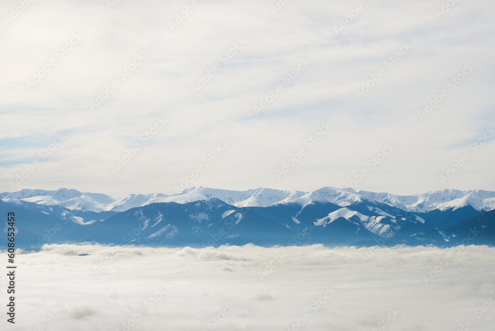 View from Cerenova skala (rock) in West Tatras in Liptov. Near Liptovsky Mikulas city in foggy weather. Spring time, cloudy weather, Slovakia. Green forest. Village in the fog. View from Cerenova skala (rock) in West Tatras in Liptov. Near Liptovsky Mikulas city in foggy weather. Spring time, cloudy weather, Slovakia. Green forest. Village in the fog.