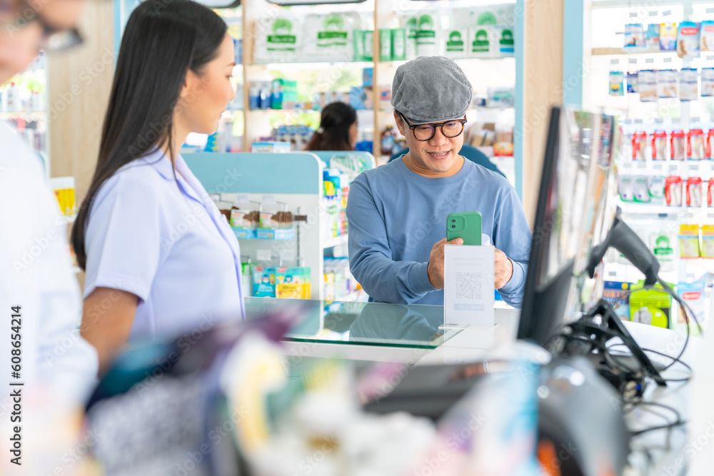 Medical pharmacy and healthcare providers concept. Professional Asian woman pharmacist recommend and selling medical product, medicine, drugs and supplements to male patient customer in drugstore.