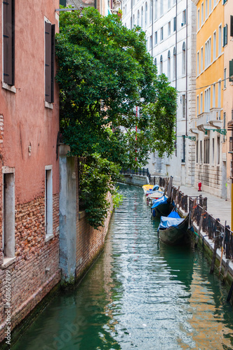 Venetian canals with gondolas. Italian architecture. Travel to Europe. 