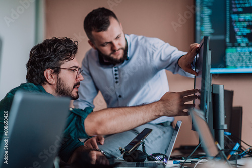 Programmers engrossed in deep collaboration, diligently working together to solve complex problems and develop innovative mobile applications with seamless functionality.