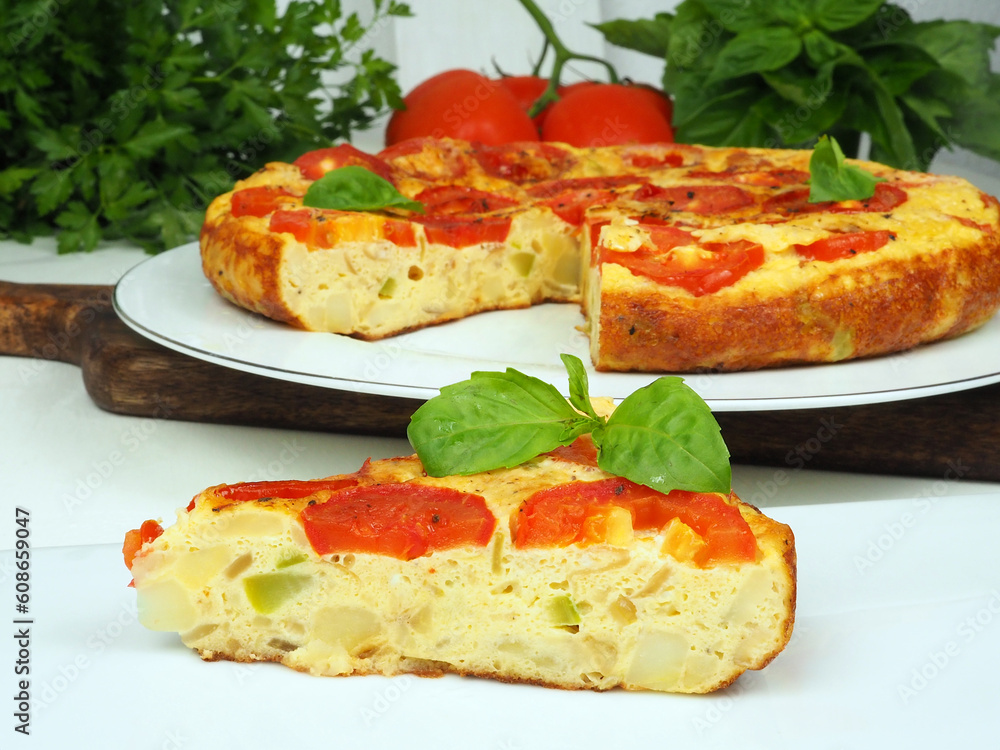 Spanish omelette with potatoes, tomatoes and zucchini Spanish omelette with potatoes, tomatoes and zucchini