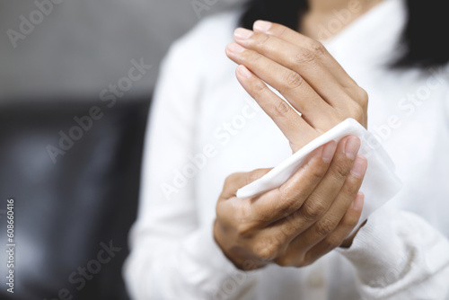 woman using tissue paper Clean your hands to remove germs.