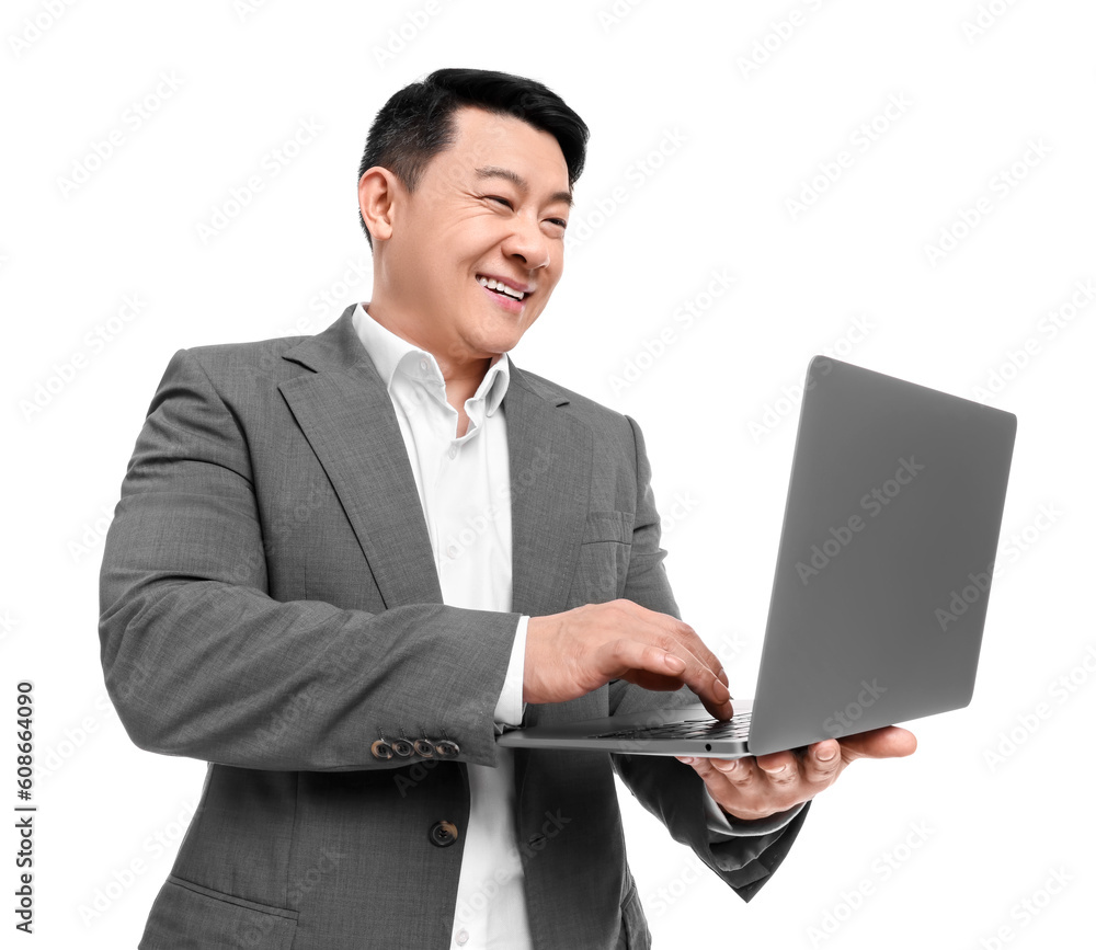 Businessman in suit working on laptop against white background