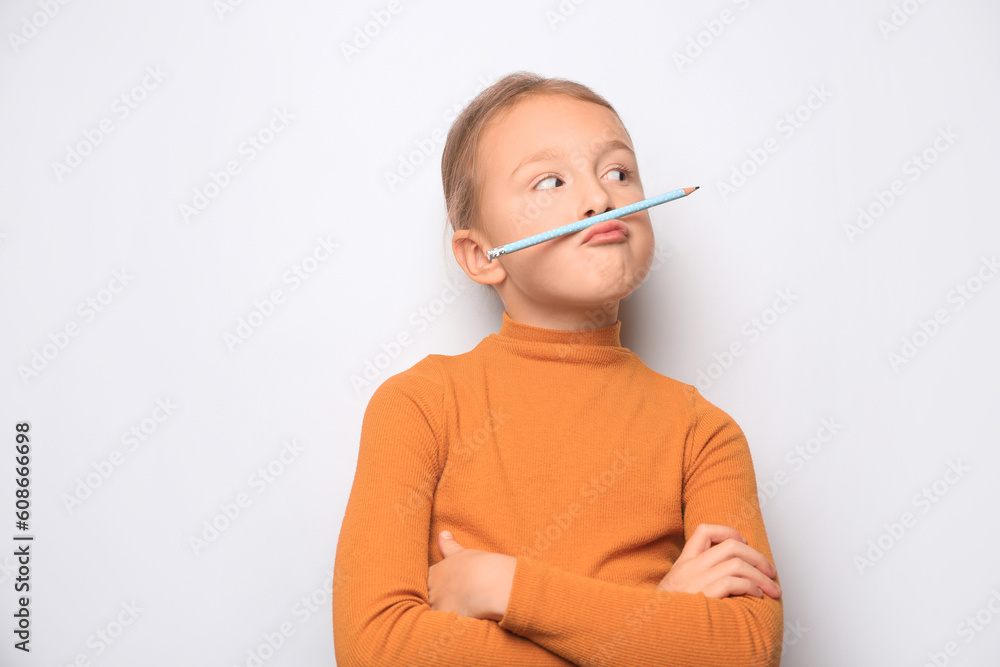 Funny little girl with pencil on white background. Space for text Funny little girl with pencil on white background. Space for text