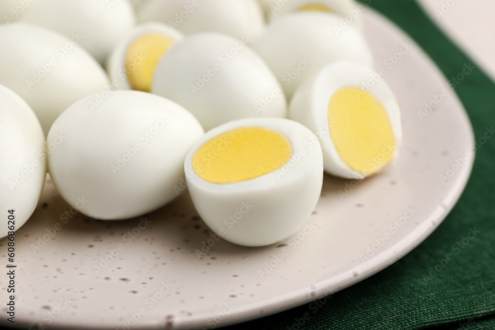 Many peeled hard boiled quail eggs on plate, closeup Many peeled hard boiled quail eggs on plate, closeup