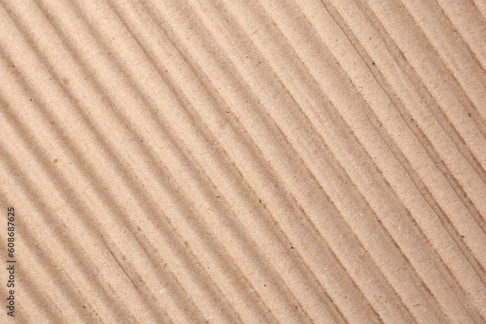 Texture of beige corrugated paper sheet as background, closeup Texture of beige corrugated paper sheet as background, closeup