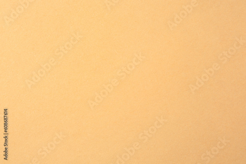 Texture of beige paper sheet as background  closeup