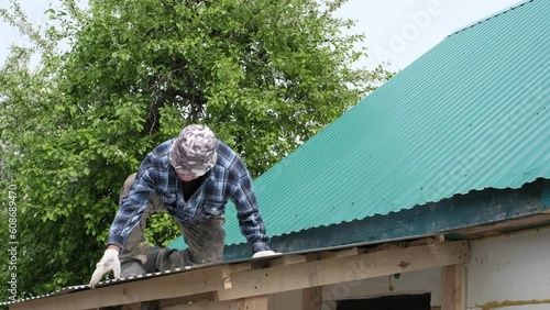 Wallpaper Mural Empowering Independence: Senior DIY Enthusiast Mastering Metal Shingle Installation. Handcrafted Dreams: Senior Builder Creating his Own Home with Precision and Passion Torontodigital.ca