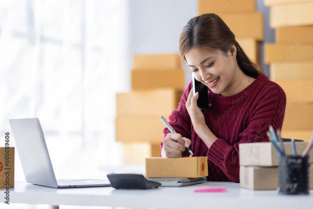 Startup small business entrepreneur SME, asian woman receive order on phone. Success young Asian small business owner home office, online sell marketing delivery, SME e-commerce telemarketing concept
Startup small business entrepreneur SME, asian woman receive order on phone. Success young Asian small business owner home office, online sell marketing delivery, SME e-commerce telemarketing concept