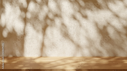 Empty table on light beige texture wall background. Leaves shadow on the wall. Mock up for presentation, branding products, cosmetics food or jewellery.