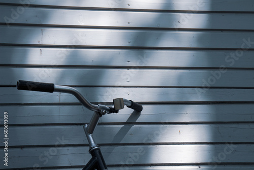 bike and shadow on old wood texture,