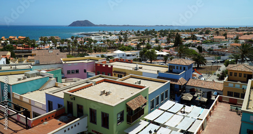 View over  roof tops at Corralejo Fuerteventura looking toward Lobos Island photo