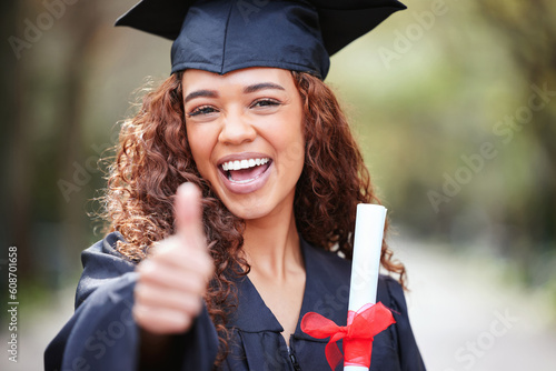 Cuadro en lienzo Thank you, portrait of female student with thumbs up and graduation day at college campus outdoors with certificate