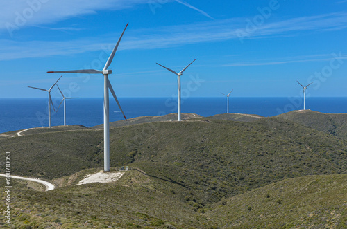 windmills of Sarpincik wind farm on the hills of Karaburun Peninsula (Parlak, Izmir province, Turkiye) photo