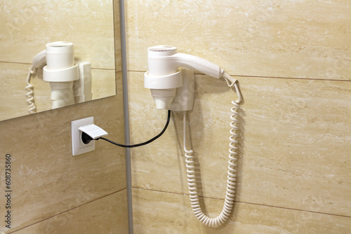 Hair dryer in hotel bathroom service concept