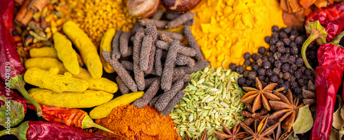 Various spices  peppers and herbs close-up top view. Eastern spice market. A set of peppers and spices for cooking.