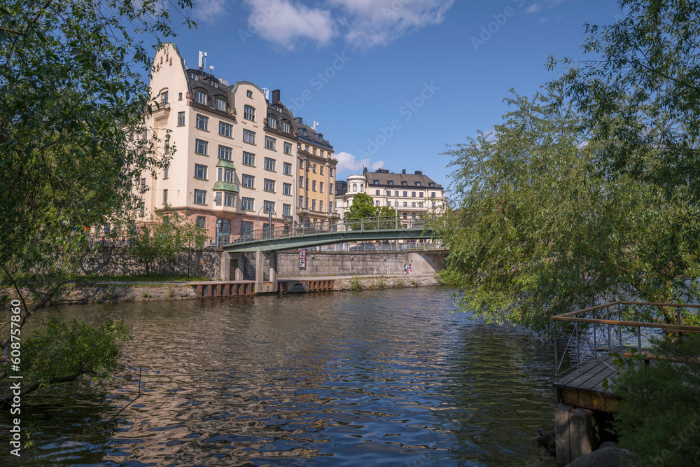 Bridges and apartment houses at the water front of the canal Karlbergskanalen, a sunny summer day in Stockholm
