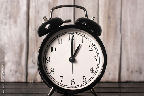 Black vintage alarm clock close-up.