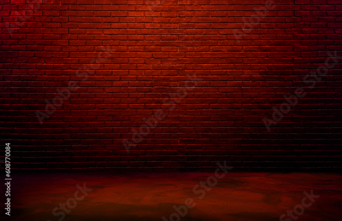 lighting effect red or brown on empty brick wall background for design. dark black brick wall background  rough concrete  plastered concrete floor  with bright red glowing lights from above.