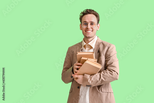 Young man with books on gre...
