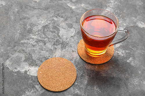 Drink coasters with cup of ...