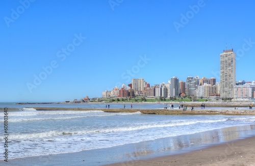 Photo of a beautiful beach in Mar del Plata, Argentina, with a stunning cityscape in the background
