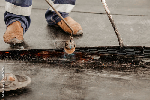 roof repair. a roofer repairs the roof. roofing tools