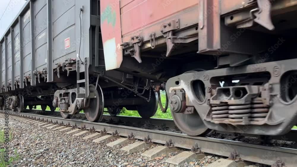 Freight long train rides on rails, close-up. Cargo transport. Railway. Static video. Railway tracks. Freight long train rides on rails, close-up. Cargo transport. Railway. Static video. Railway tracks.