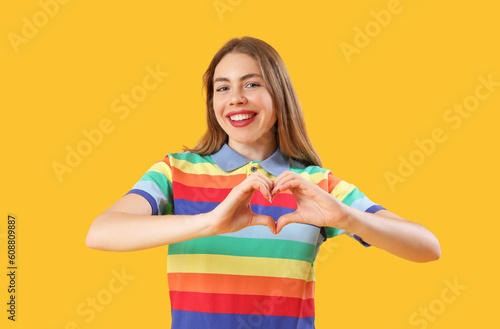 Young woman in rainbow shir...