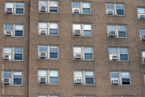 Multiple windows and air conditioning units.