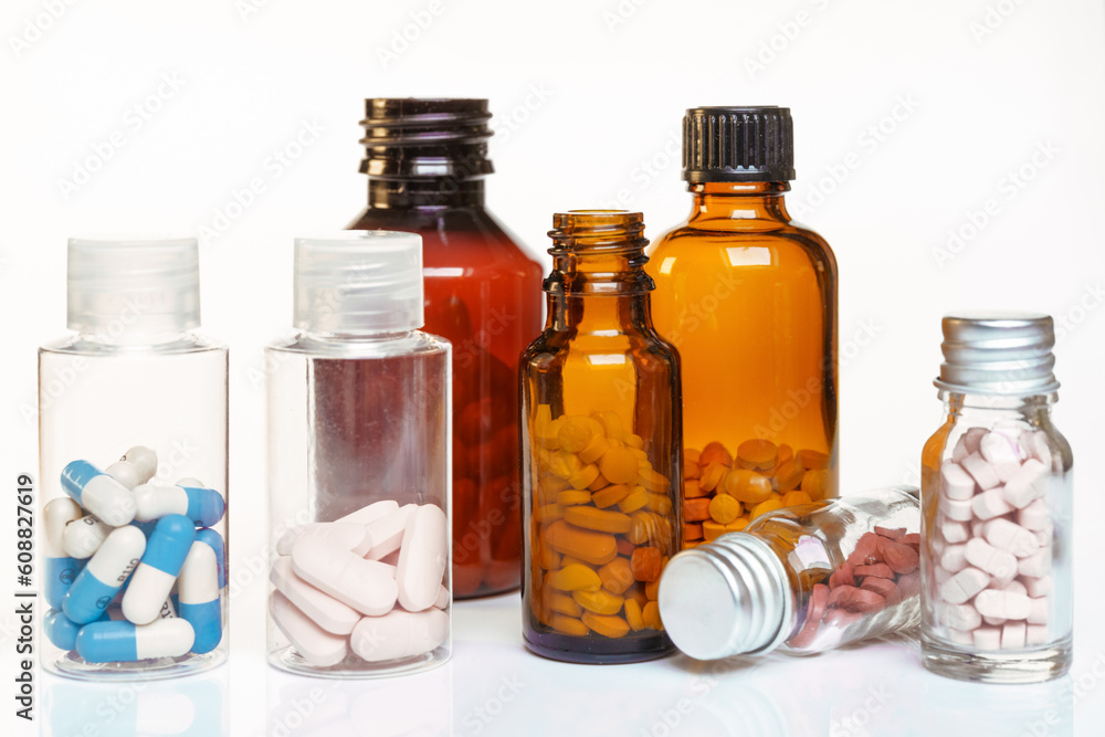Group of bottles of medicine with pills. Group of bottles of medicine with pills.