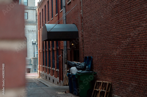 narrow alley with overflowing trash
