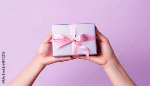Hands holding holiday gifts - professional photo studio background. Generative IA. © PGS
