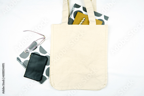 Tote Bag mockup on white background. Eco-friendly, reusable canvas carry bag. Masculine school, desk, office theme.