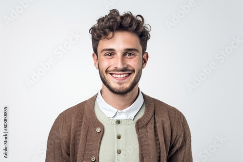 Group portrait photography of a satisfied man in his 20s that is wearing a chic cardigan against a white background . Generative AI