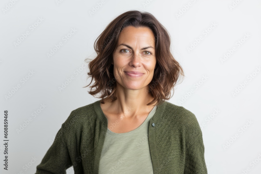 Portrait of smiling woman looking at camera on white background in studio Portrait of smiling woman looking at camera on white background in studio