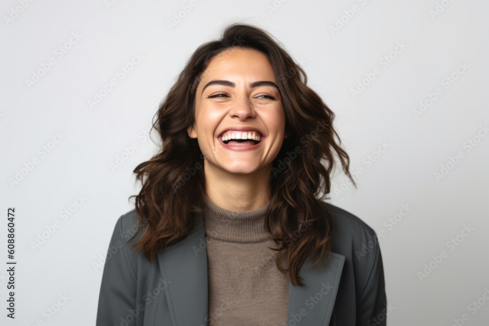 Portrait of a happy young woman laughing isolated on a white background Portrait of a happy young woman laughing isolated on a white background