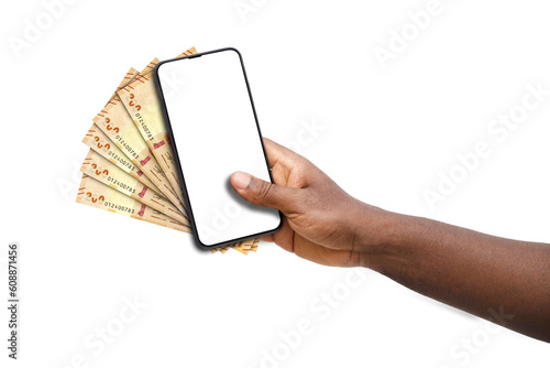 Black hand holding mobile phone with blank screen and Bolivian boliviano notes photo